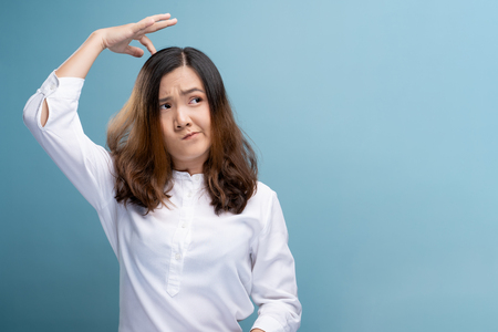 Woman scratching her headの写真素材