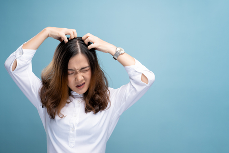 Woman scratching her head