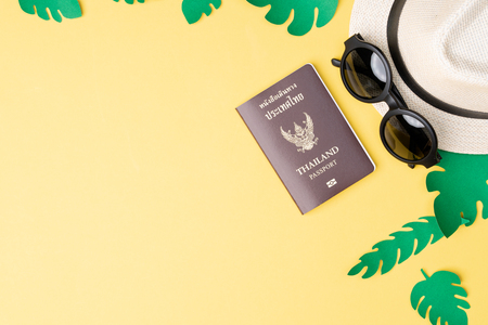 Top view of summer concept with accessories on yellow backgroundの写真素材