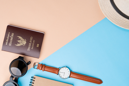 Top view travel concept with accessories on abstract beach backgroundの写真素材