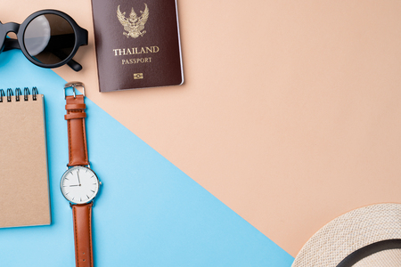 Top view travel concept with accessories on abstract beach backgroundの写真素材