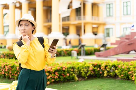 Woman traveler lost in the city used smart phone for searching locationの写真素材