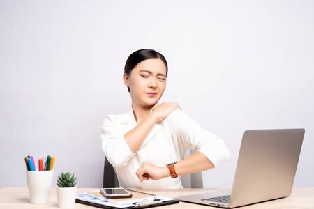 Woman has body pain isolated over white background: Office syndrome conceptの写真素材