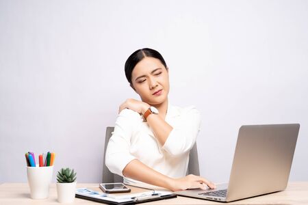 Woman has body pain isolated over white background: Office syndrome conceptの写真素材