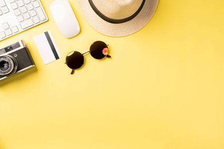 Top view summer concept with accessories on yellow background with copy spaceの写真素材