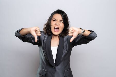 Angry woman screaming isolated over white backgroundの写真素材