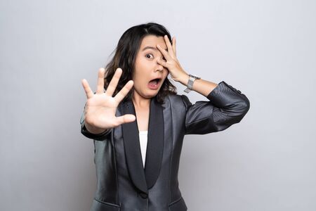 Woman feel scared standing isolated over white background