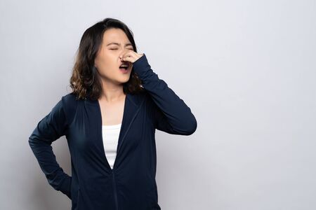 Woman was sick with fever isolated over white backgroundの写真素材