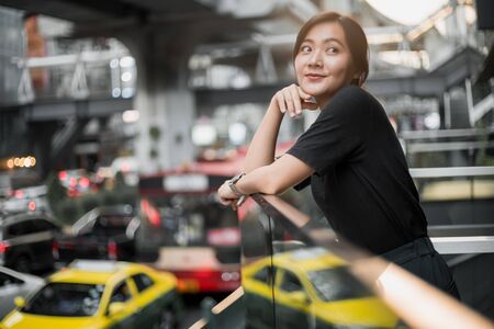 Portrait of happy asian woman in the cityの写真素材