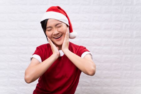 Happy woman wear santa hatの写真素材