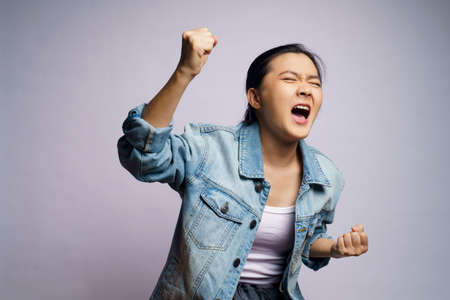 Asian woman shouting isolated on white background.の写真素材