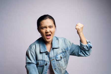 Asian woman shouting isolated on white background.