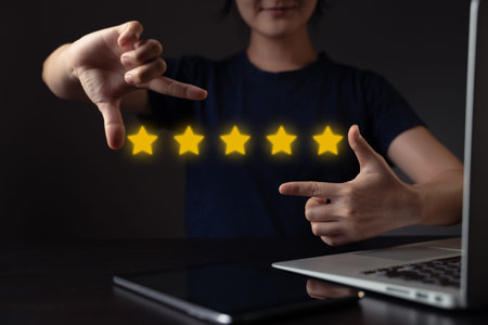 Woman using laptop planning digital marketing with chart hologram effect.
