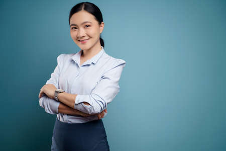 Asian woman was sick with eyes pain, irritate itching her eyes, isolated on background.の写真素材