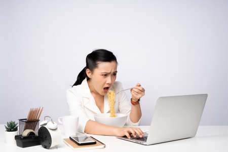 Asian woman happy smiling take a break after working on a laptop. isolated on white background.の写真素材