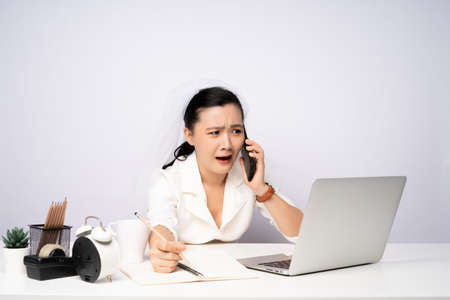 Asian woman happy smiling take a break after working on a laptop. isolated on white background.の写真素材