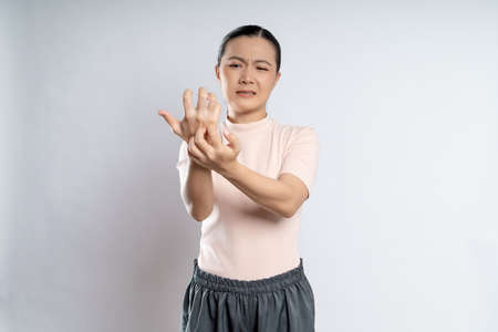 Asian woman happy confident smiling, looking at camera, standing isolated on white background.の写真素材