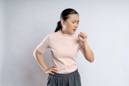 Asian woman happy confident smiling, looking at camera, standing isolated on white background.の写真素材