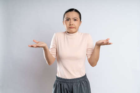 Asian woman happy confident smiling, looking at camera, standing isolated on white background.の写真素材