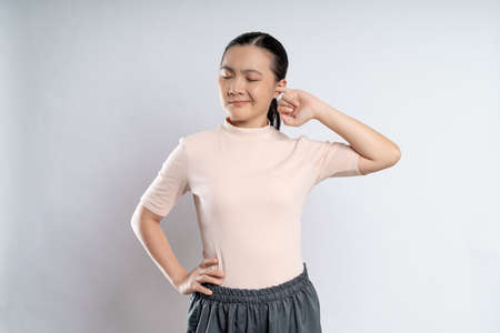 Asian woman happy confident smiling, looking at camera, standing isolated on white background.の写真素材