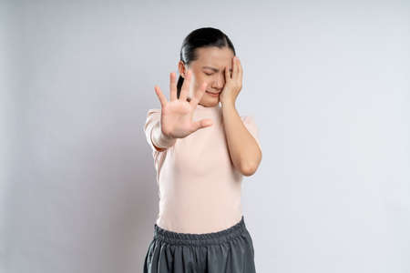 Asian woman happy confident smiling, looking at camera, standing isolated on white background.の写真素材