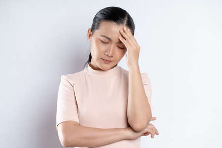 Asian woman happy confident smiling, looking at camera, standing isolated on white background.の写真素材