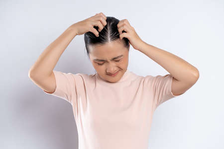 Asian woman happy confident smiling, looking at camera, standing isolated on white background.の写真素材