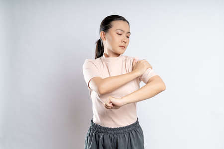 Asian woman happy confident smiling, looking at camera, standing isolated on white background.の写真素材