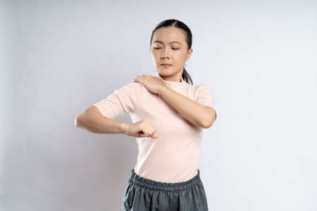 Asian woman happy confident smiling, looking at camera, standing isolated on white background.の写真素材