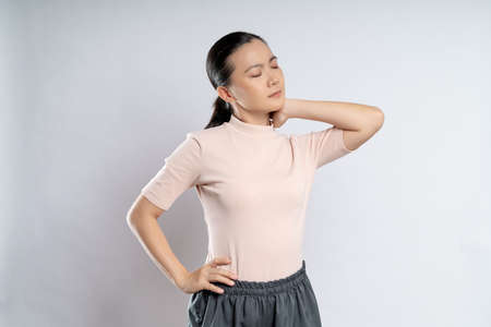Asian woman happy confident smiling, looking at camera, standing isolated on white background.の写真素材