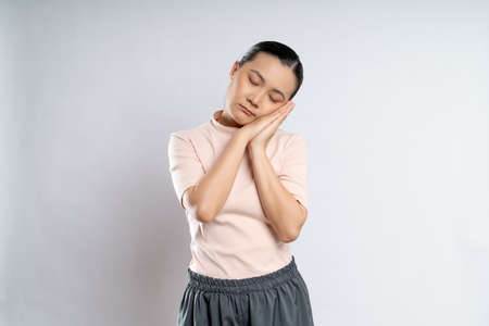 Asian woman happy confident smiling, looking at camera, standing isolated on white background.の写真素材