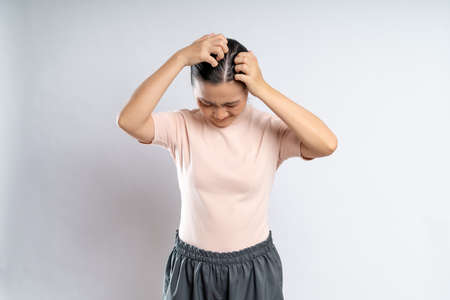 Asian woman happy confident smiling, looking at camera, standing isolated on white background.の写真素材