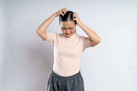 Asian woman happy confident smiling, looking at camera, standing isolated on white background.の写真素材