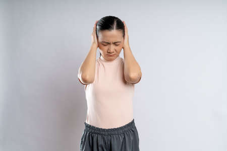Asian woman happy confident smiling, looking at camera, standing isolated on white background.の写真素材