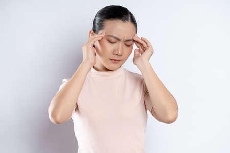 Asian woman happy confident smiling, looking at camera, standing isolated on white background.の写真素材