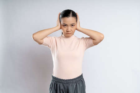 Asian woman happy confident smiling, looking at camera, standing isolated on white background.の写真素材