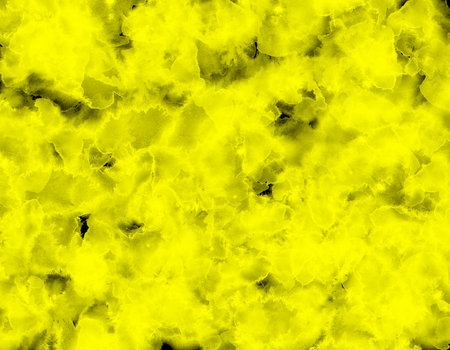 hand painted yellow watercolor on black backgroundの写真素材