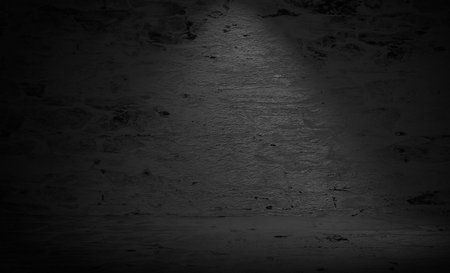 Abstract black and white grunge background. Dark room with spotlight.の写真素材