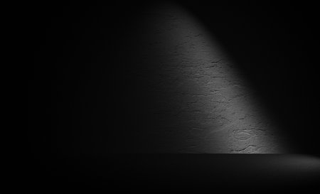 Empty room with spotlight on the wall. Black and white background.の写真素材