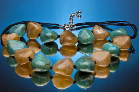 Gemstone Necklace in blue backgroundの写真素材