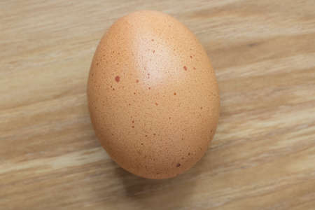 egg cloves on wooden vintage background.の写真素材