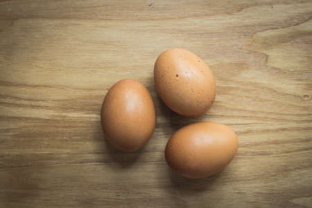 eggs cloves on wooden vintage background.の写真素材
