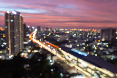 cityscape view of a building, sky train and twilight sky in Bangkok