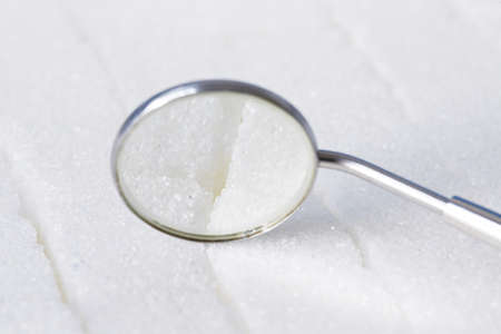 Dental mirror on the sugar の写真素材