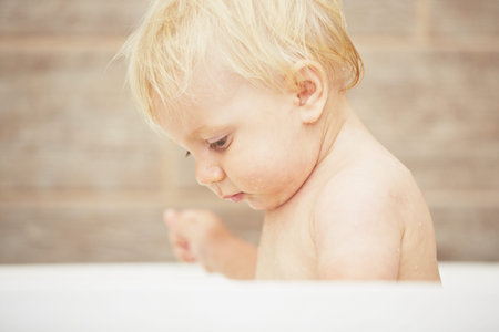 Blond baby in the bathroom