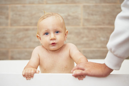 Blond baby in the bathroom
