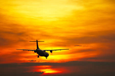 Airplane is landing at sunset, Pragueの写真素材