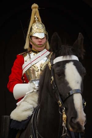 Member of the Royal Horse Guards in traditional body armor with helmet on sentry in front of the palace Horse Guard in October 26, 2012 in London, United Kingdom.のeditorial素材