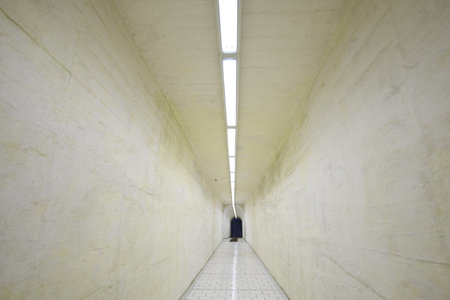 Narrow corridor in old underground hospital