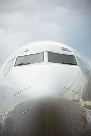 Front view of airplane in bad weatherの写真素材